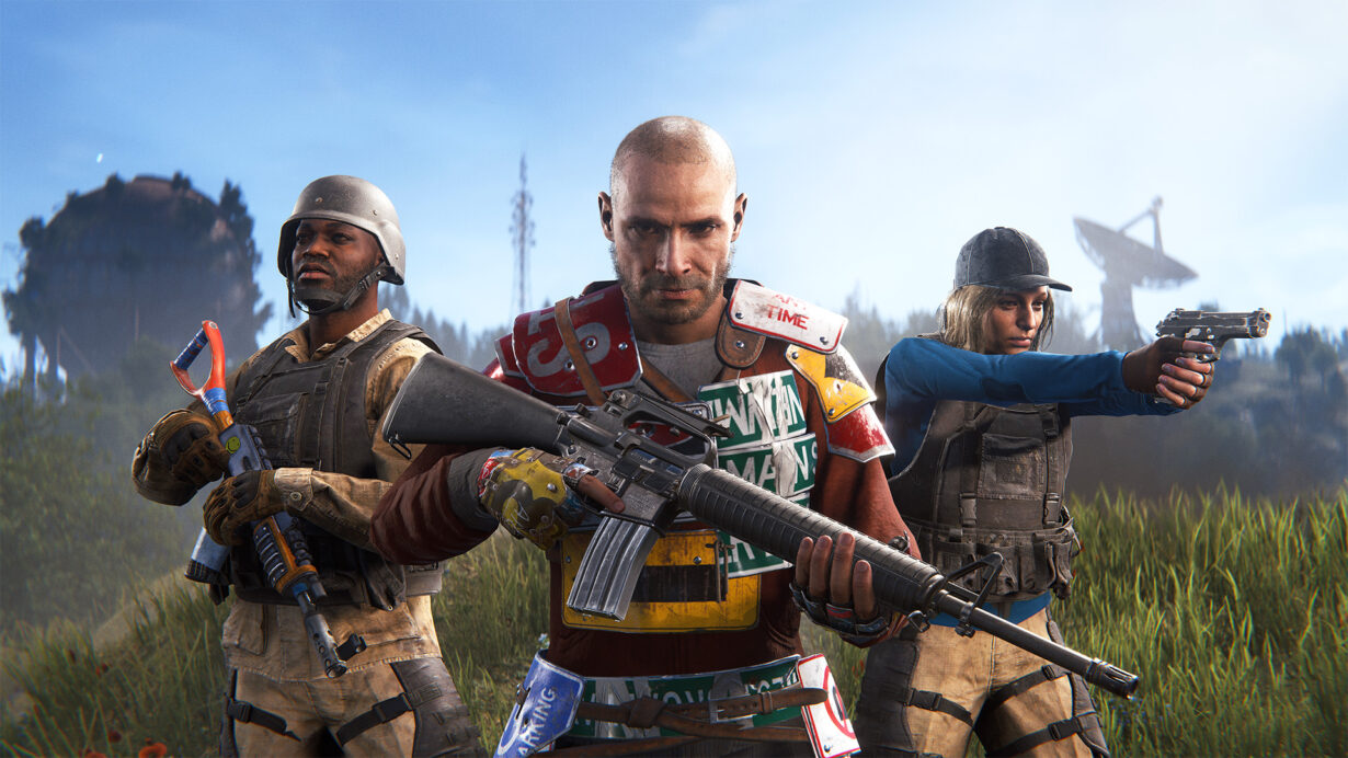 Three armed video game characters in post-apocalyptic gear standing in a field, with a satellite dish visible in the background