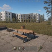 Rust gameplay screenshot showing a picnic table on a concrete patio near a multi-story building, with Getting Started tutorial objectives visible